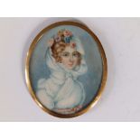 A late 19thC oval watercolour miniature - Portrait of young lady with pale blue scarf and flowers in