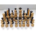 Two early 20thC carved wood chess sets, the Kings 3.1" & 2.8" respectively. (64)