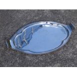 An oval EP tea tray , 25.5" across handle scrolls.