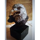 An American painted bronze limited edition study of a bald eagle's head on square black marble