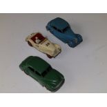 Three Dinky cars - Triumph 1949-55, MG Midget 1955-59 and Morris Oxford 1954-56.