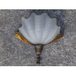 Early 20thC brass wall light with frosted glass shade in shell form, 12" across.