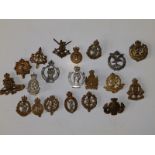 20 military corps cap badges.