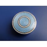 A circular 925 metal box, the detachable lid with pale blue & white guilloche decoration, gilt
