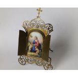 A late 19thC Italian gilt brass framed devotional porcelain panel, two hinged doors revealing an