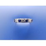 A sapphire & diamond set 18ct gold half eternity ring. Finger size P.