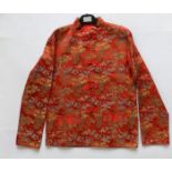 A 1950's Chinese red satin jacket.