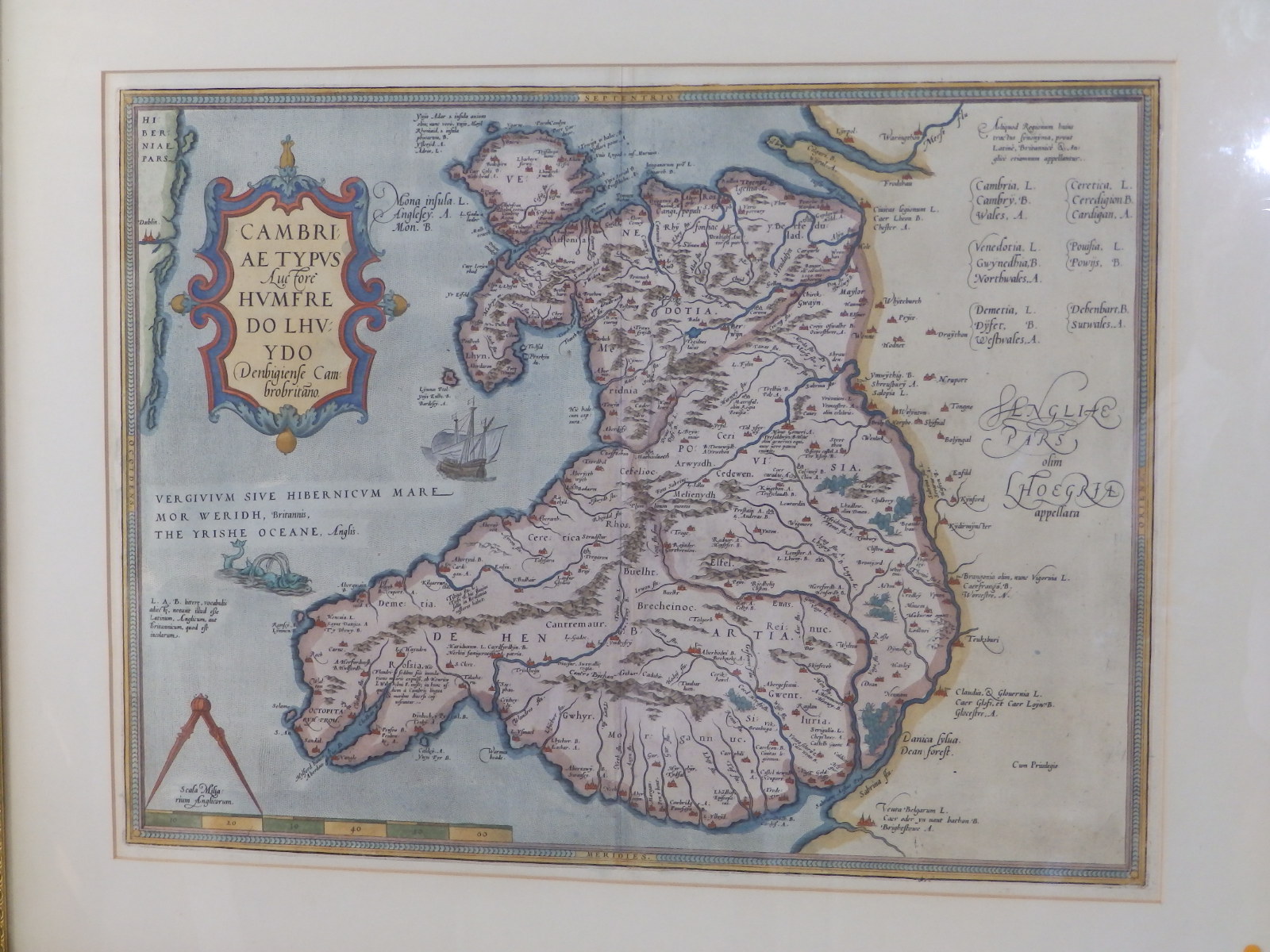 An antiquarian coloured map of Wales, 14" x 19.5".