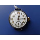A WWI silver trench watch with white enamel dial, luminous hands and numerals, subsidiary seconds,