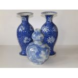 A pair of Chinese blue & white porcelain vases of slender baluster form with flared rims,