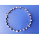 A diamond & pearl set 'knife edge' link bracelet, 8".