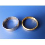 A 22ct wedding band and a 9ct band. (2)