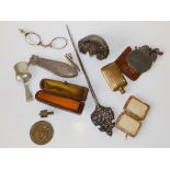 An amber coloured cheroot holder in case and various collectors' items.