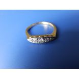 A graduated old cut five stone diamond ring on yellow metal shank with 'PLAT' setting, total diamond