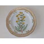 A Royal Copenhagen porcelain Flora Danica plate in St. John's Wort pattern - 'Hypericum perforatum