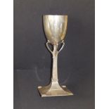 A Jugendstil .800 white metal goblet on spreading square foot, 11.6" high.