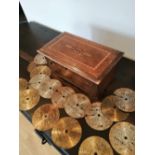 A late 19thC disc musical box together with 16 x 4.5" discs.