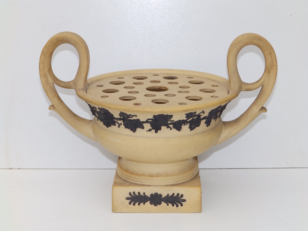 An early 19thC Wedgwood bough pot, of matt caneware colour applied dark brown/black grape vine