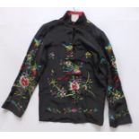 A Chinese embroidered silk reversible jacket.