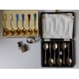 A cased set of six Sheffield silver coffee spoons, six Norwegian enamelled silver gilt spoons, a