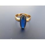 A Swedish 18ct gold ring set with a slender cabochon synthetic sapphire, inscribed to interior of