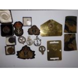 A Coldstream Guards brass bed plate and various other military items.