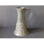 A Liberty & Co. Tudric pewter jug of spreading conical form decorated stylised flower sprays in