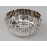 A fluted silver sugar bowl - WO, Birmingham 1899, 4.25" diameter.