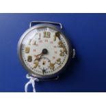 A WWI white metal trench watch with French Swan silver mark to case - the 24 hour dial with cracks