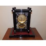 A modern Japanese Seiko battery operated mantel clock in ebonised Aesthetic taste case, 14" high.