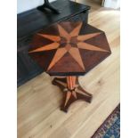 An octagonal parquetry occasional pedestal table.