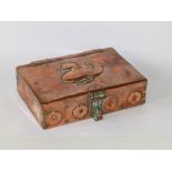 A John Pearson copper box, the hinged lid decorated in relief with a bird, fastening with a
