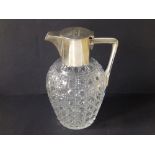 A small silver mounted art deco cut glass presentation claret jug by Hukin & Heath, the flat