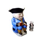 A giant Devonmoor Pottery toby jug, dressed in blue jacket, with black hat, yellow waistcoat &