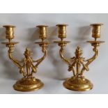 A pair of 20thC reproduction ormolu twin-branch candelabra with detachable sconces, drilled for