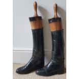 A pair of leather riding boots.