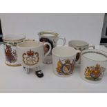 A Carlton Ware two-legged QEII Silver Jubilee cup and five other modern commemorative cups/tankards.