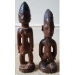 Two African Ibeji carved wood figures, the taller 11.5" high.