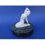 Attributed to Ferdinand Preiss - an Art Deco ivory figure of a kneeling young female nude -