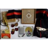 A collection of various military items including a Worcestershire Regiment framed emblem, a WWII map