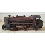 A scratch built painted metal 2-4-2 locomotive with heavy cast iron boiler. 14.5" across