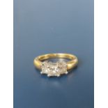 A three stone princess cut diamond ring in 18ct gold, total diamond weight 1.03 carats. Finger