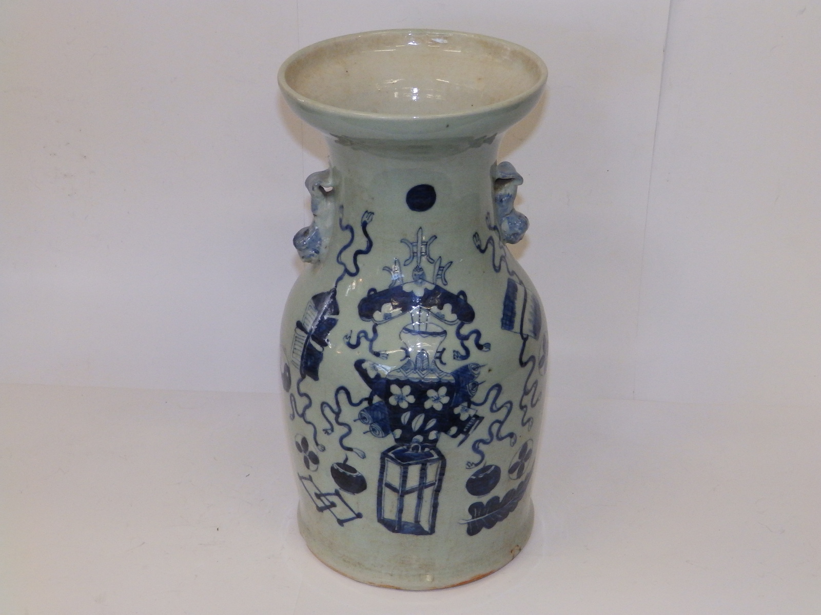 An antique Chinese blue & white porcelain , the flared rim above shouldered body applied with two