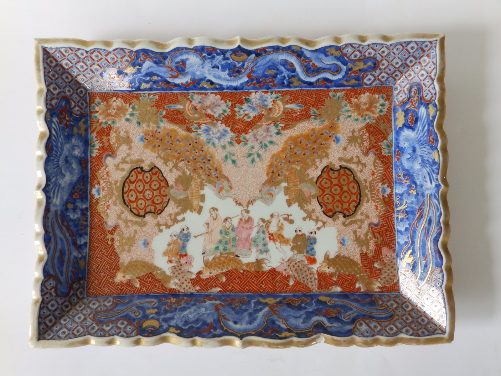 A 19thC Japanese Imari porcelain rectangular tray, decorated to the centre with a complex scene