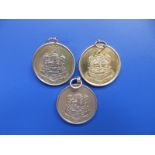 Three 9ct gold medals - Cuaco Sports - J.J. Williamson.