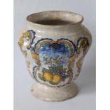 An 18thC continental maiolica jar, probably Italian, decorated with a cartouche depicting a