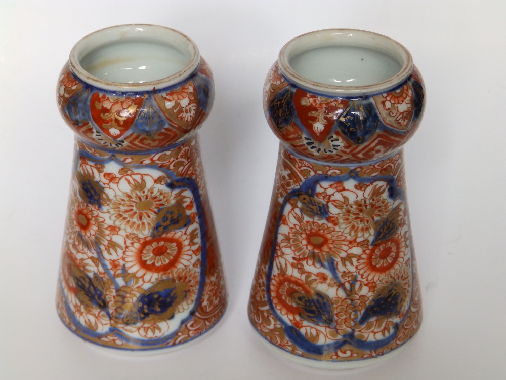 A small pair of Imari porcelain vases, of tapering shape with bulbous necks, three rows of script to - Image 2 of 4