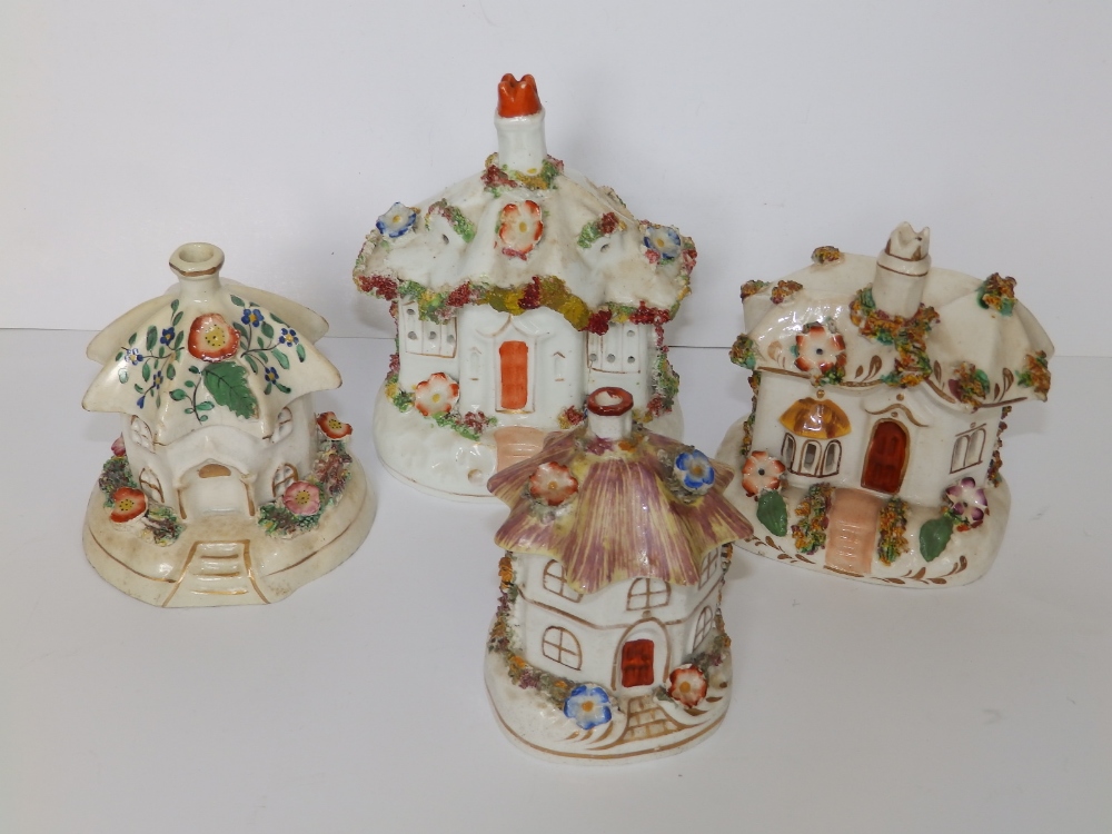 Four Victorian Staffordshire cottage pastille burners, the tallest 5".