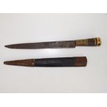 A Middle Eastern dagger with brass & bone hilt in leather covered sheath, blade 12" - rusted.