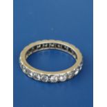 A diamond set white metal eternity ring, tests as 18ct, total diamond weight approximately 1.2